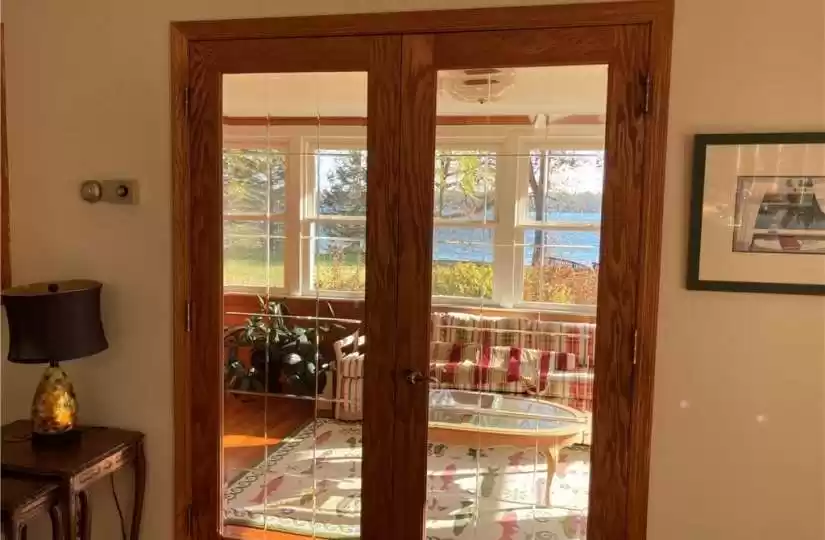 French doors btwn three season porch and dining area