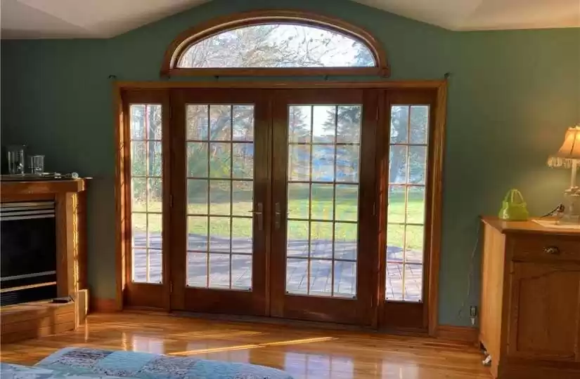 primary suite view with French doors open to deck to enjohttps://ranww.mlsmatrix.com/Matrix/MediaManager/ShowImage.aspx?tbl=9&mtid=1&tmui=200203088&mf=P200261406a7ba84eb-5103-47d1-b908-38ff5f894fd9U-1&w=128&h=96&q=99&md=2021-11-09%2012:48:55.963y the lakeside fresh air