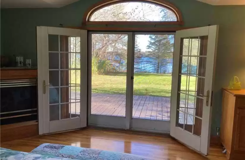 primary suite view with French doors open to deck to enjohttps://ranww.mlsmatrix.com/Matrix/MediaManager/ShowImage.aspx?tbl=9&mtid=1&tmui=200203088&mf=P200261406a7ba84eb-5103-47d1-b908-38ff5f894fd9U-1&w=128&h=96&q=99&md=2021-11-09%2012:48:55.963y the lakeside fresh air