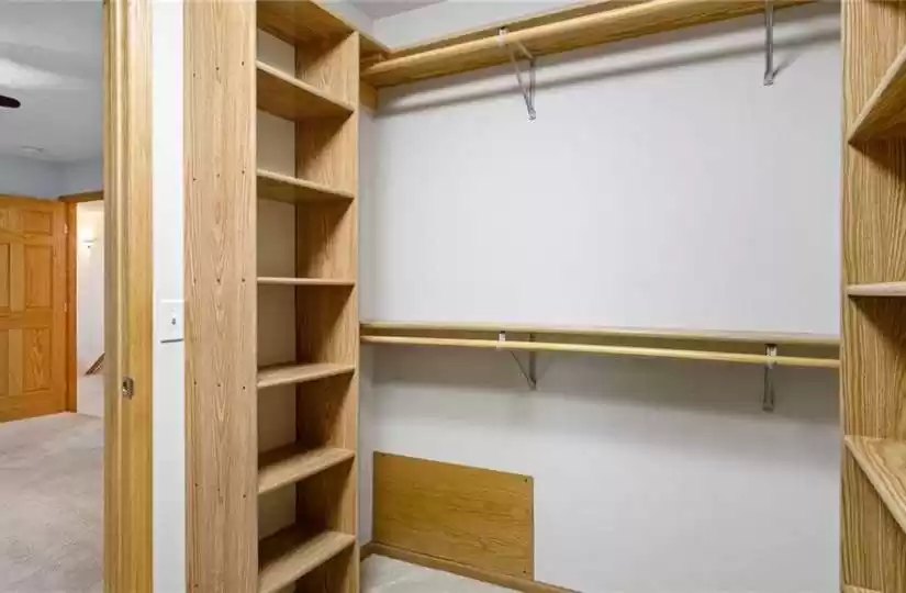 Very large walk in closet with custom shelving!